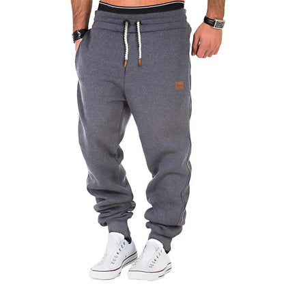 Plain-colored jogging trousers with drawstring waist for men