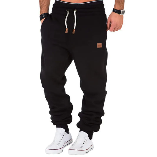 Plain-colored jogging trousers with drawstring waist for men