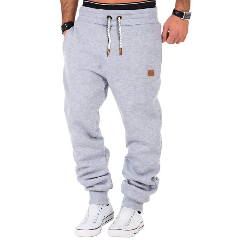 Plain-colored jogging trousers with drawstring waist for men